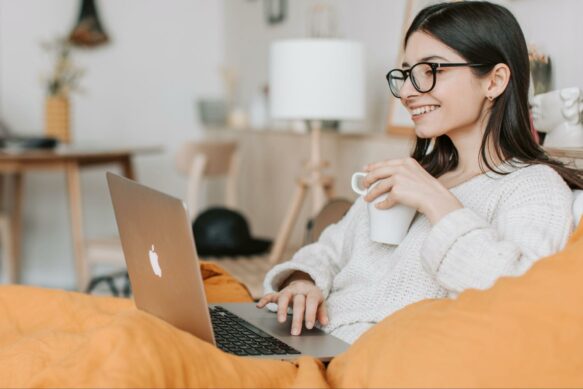 woman on laptop smiling