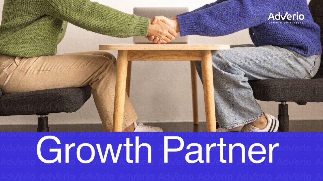 Amazon Agency vs. In-House Management: How M+ Brands Make the Right Call 8 Two people shake hands across a table with a laptop, symbolizing a business partnership for growth.