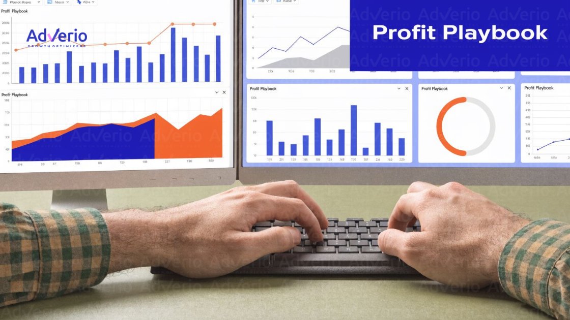 Unlock Profit with Amazon Search Term Report Strategy 22 A person's hands typing on a keyboard in front of dual monitors showing business dashboards with charts and data.