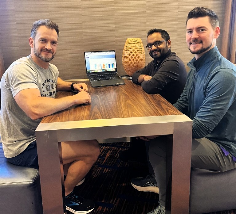 Home 57 Adverio leadership reviewing marketplace performance dashboards at the San Francisco summit